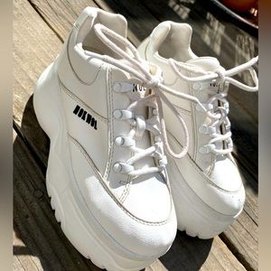Women’s white platform shoes.